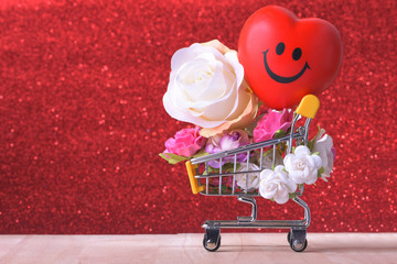 Love and happy Valentines day roses colorful and red heart symbol in shopping cart.