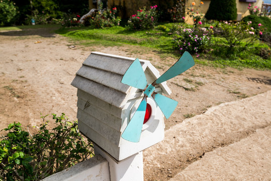 Wooden Mailbox for receive the envelope stand in front of home in the garden
