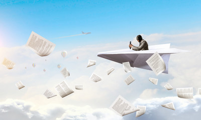 Aviator in paper plane. Mixed media