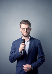 Businessman holding microphone