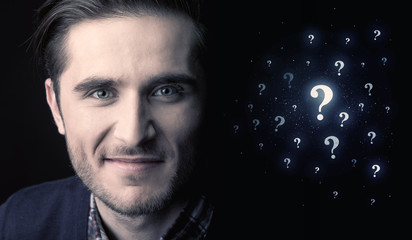 man with many question mark near him