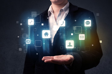 Businessman holding blue applications