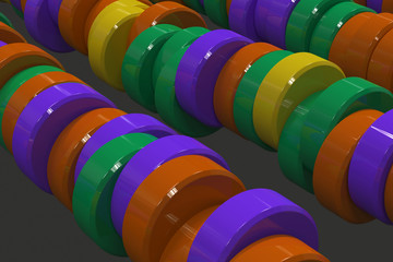 Pattern of yellow, violet and green cylinder tablets on black background