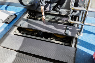 escalator in department store or airport  fixing by technician for passenger