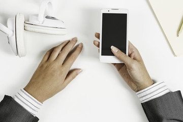 Businesswoman using her smartphone