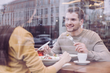 My darling. Enthusiastic pleased nice guy dating with woman while looking at her and smiling