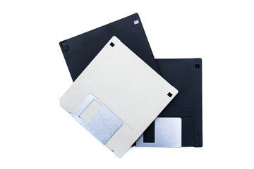 Three old retro computer disks on isolated white background. 