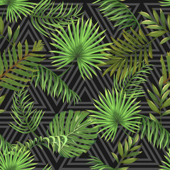 Naklejka na ściany i meble Seamless pattern with leaves of palm trees on a dark background with a triangular ornament