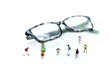 Miniature people : children and student  with glasses,education concept.