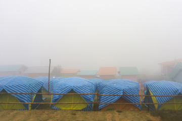 Travel tent in the morning with fog