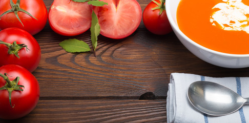 tomato soup on a wooden table top view