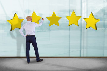 Businessman in front of a wall with Five 3d render yellow stars