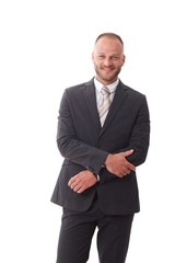 Happy businessman standing in suit