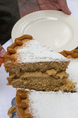 Vanilla cake withe powdered sugar and milk cream
