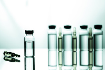 Group of ampoules with a transparent medicine in medical laboratory