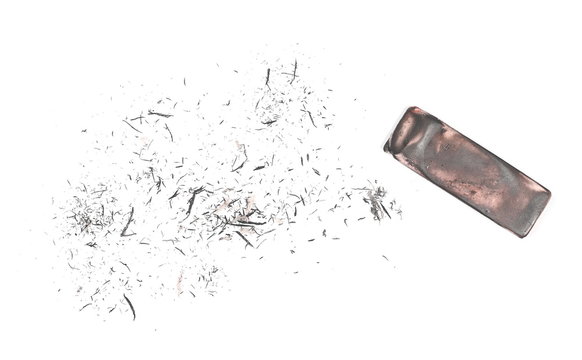 Graphite stained eraser with shavings isolated on white background, top view