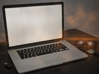 Laptop on the table and different accessories