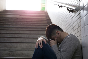 depressed man sit in underground
