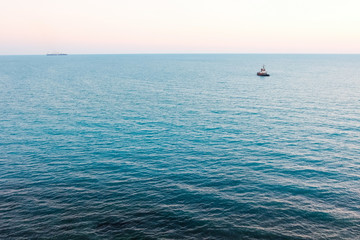 Fototapeta premium Two ships floating on the sea. Summer day on the sea.