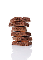 Close-up pieces of porous chocolate bar