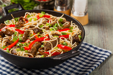 Chinese pasta with beef. Prepared in wok.