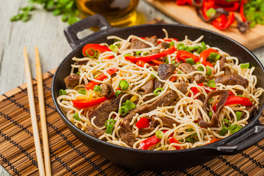 Chinese pasta with beef. Prepared in wok.