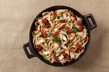 Whole-grain tagliatelle pasta with grilled chicken.