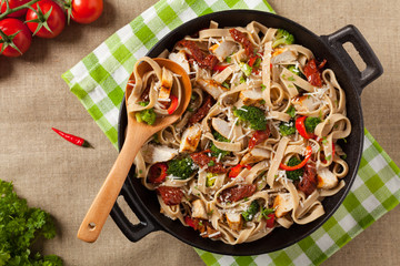 Whole-grain tagliatelle pasta with grilled chicken.