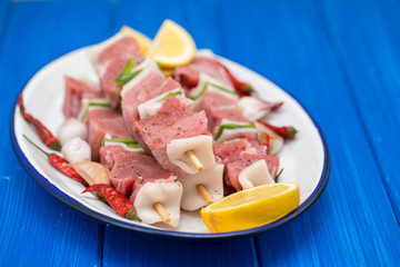 raw turkey fillet with pepper and lemon