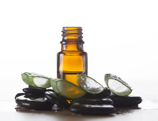 Essential oil for aromatherapy, stones and fresh aloe vera