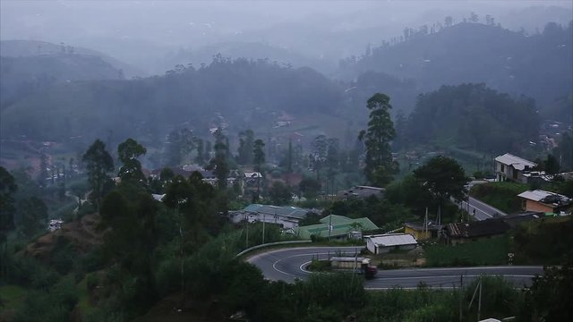 Truck moving on the asphalt road in region of town of Haputale, Sri Lanka