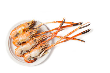 Grilled shrimps on whiite background with copy space
