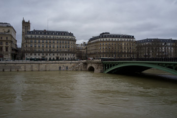 Fototapeta na wymiar Rising River Seine, Pont Notre-Dame, Paris, France