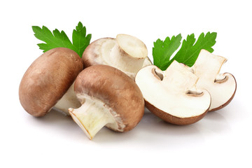 Royal Brown champignon with half and parsley leaf isolated on white background