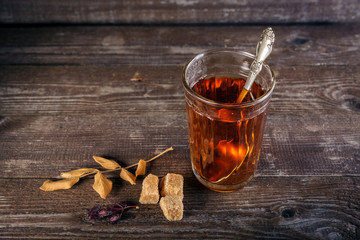 Faceted glass with tea