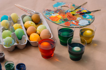 Obraz na płótnie Canvas freshly painted easter eggs with paint on table