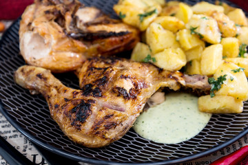 roast chicken with sauce and golden French fries potatoes