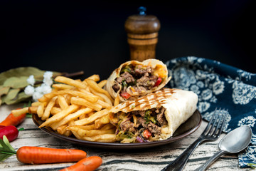 Mexican fajita wraps with grilled chicken fillet and fresh vegetables