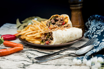 Mexican fajita wraps with grilled chicken fillet and fresh vegetables