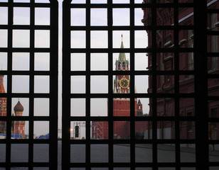 MOSCOW, RUSSIA - September 5, 2008: View of the Kremlin's Rescue Tower on the Red Square through the lattice of the gate of the left entrance of the Sunday Gates