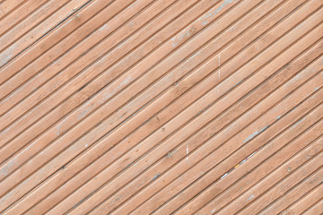 Diagonal light brown boards. Texture. Background