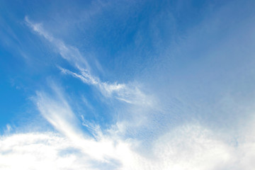 blue sky background with tiny clouds.