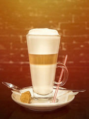 A cup of fresh aromatic coffee in a cafe