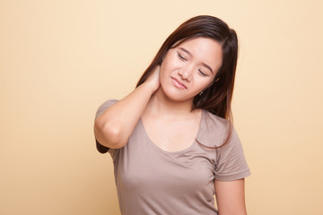 Young Asian woman got neck pain.