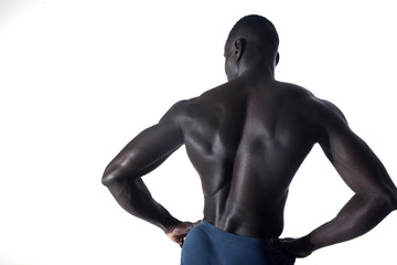 portrait of a black athletic man on his back