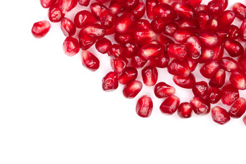 pomegranate seeds isolated on white background with copy space for your text. Top view. Flat lay pattern