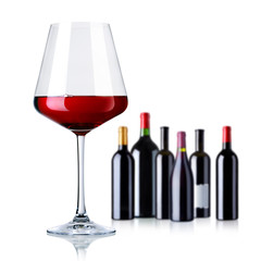 red wine glass and bottles isolated on white