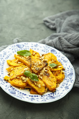 Baked pumpkin with honey glaze and nuts