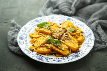 Baked pumpkin with honey glaze and nuts