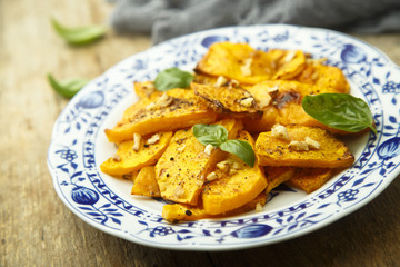 Baked pumpkin with honey glaze and nuts